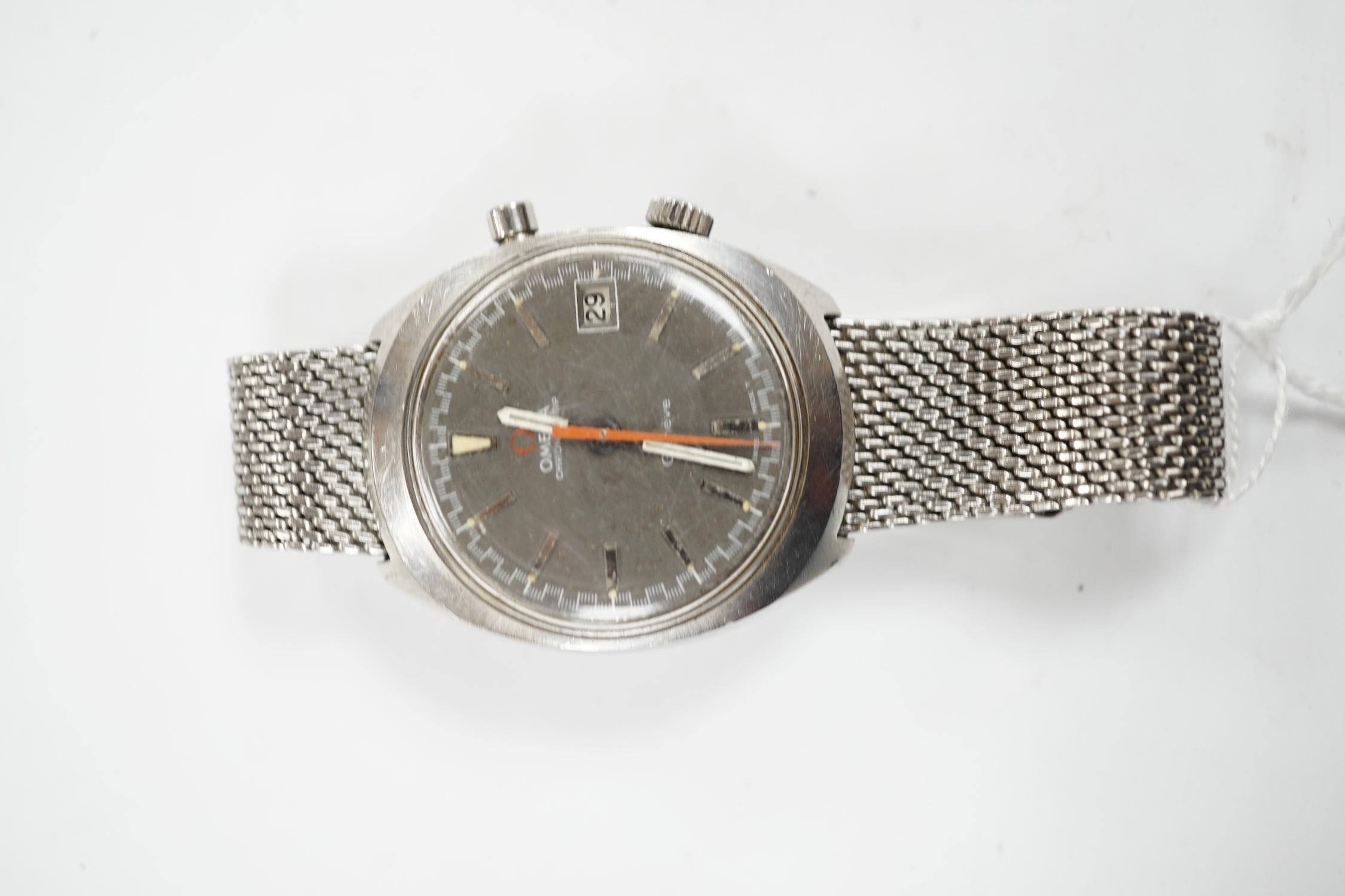 A gentleman's 1970's? stainless steel Omega Chronostop manual wind wrist watch, on a steel Omega mesh link bracelet.